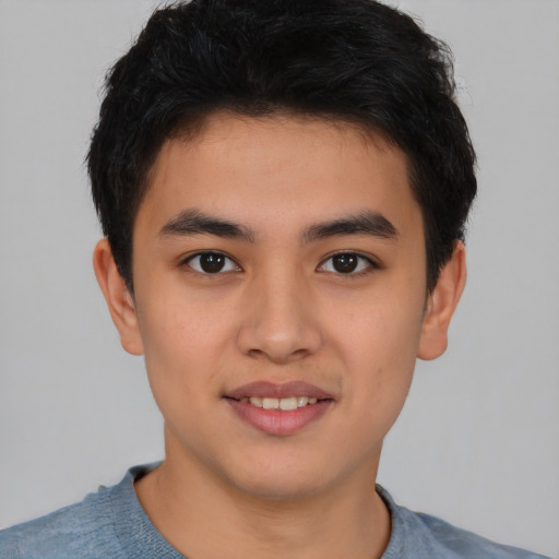 Joyful latino young-adult male with short  brown hair and brown eyes