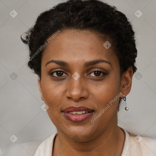 Joyful black young-adult female with short  brown hair and brown eyes