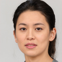 Joyful white young-adult female with medium  brown hair and brown eyes