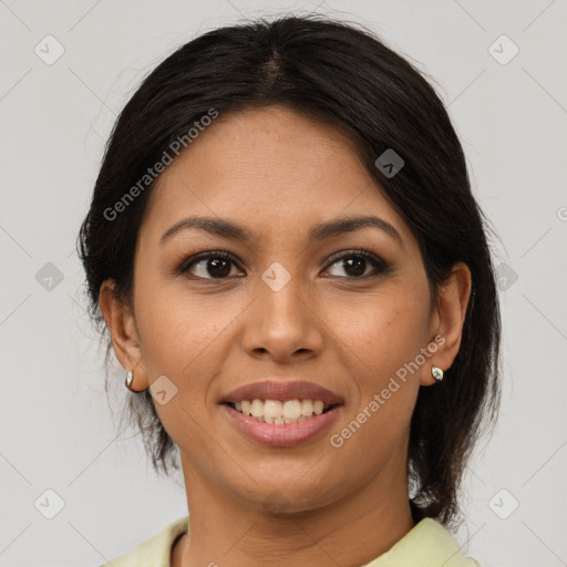 Joyful latino young-adult female with medium  brown hair and brown eyes