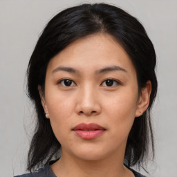 Joyful asian young-adult female with medium  black hair and brown eyes