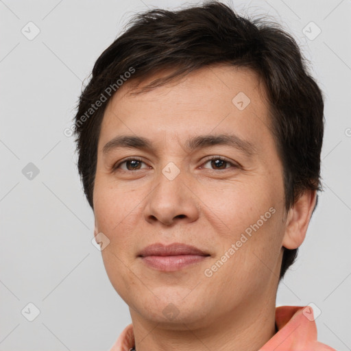 Joyful white adult male with short  brown hair and brown eyes