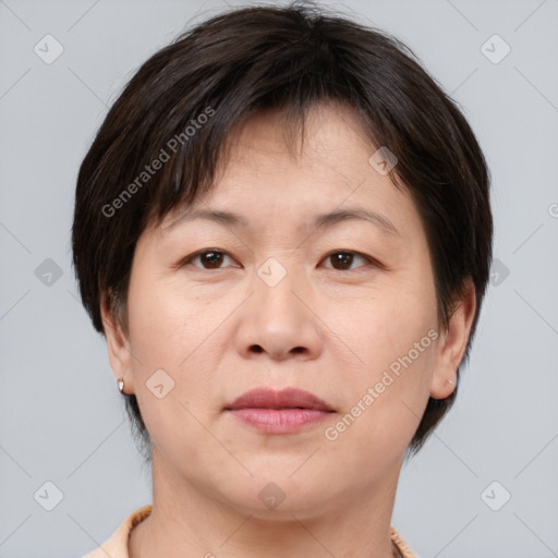 Joyful white adult female with medium  brown hair and brown eyes