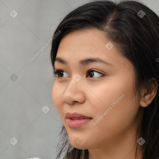 Joyful asian young-adult female with medium  black hair and brown eyes