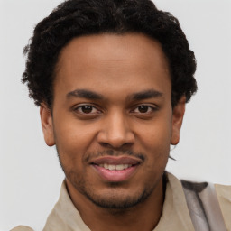 Joyful latino young-adult male with short  brown hair and brown eyes