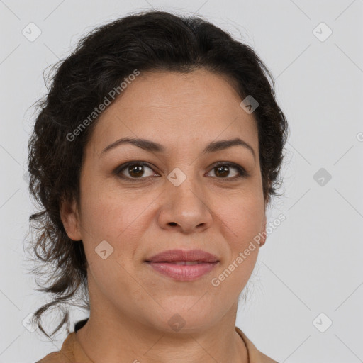 Joyful latino adult female with medium  brown hair and brown eyes