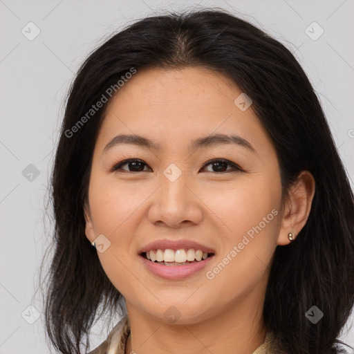 Joyful asian young-adult female with long  brown hair and brown eyes