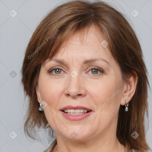 Joyful white adult female with medium  brown hair and grey eyes