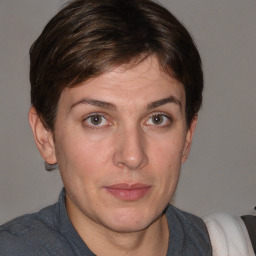 Joyful white adult female with short  brown hair and brown eyes