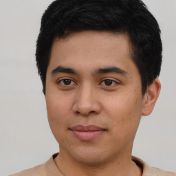 Joyful asian young-adult male with short  brown hair and brown eyes