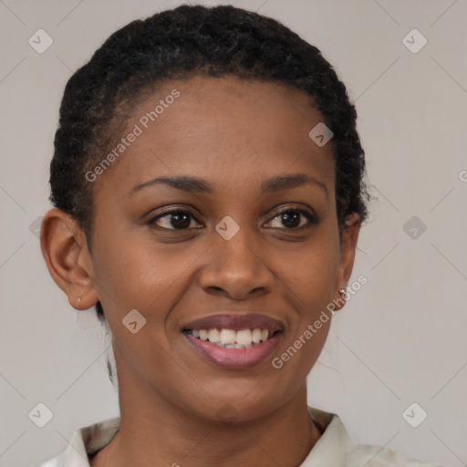 Joyful black young-adult female with short  brown hair and brown eyes