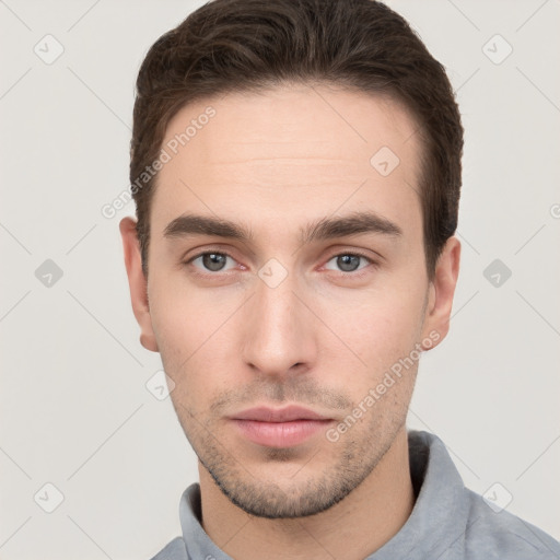 Neutral white young-adult male with short  brown hair and brown eyes