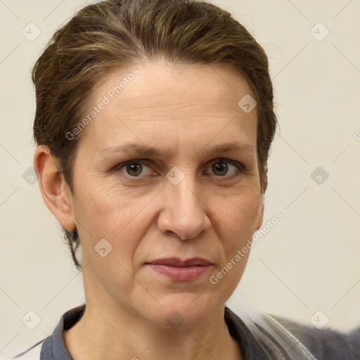 Joyful white adult female with short  brown hair and brown eyes