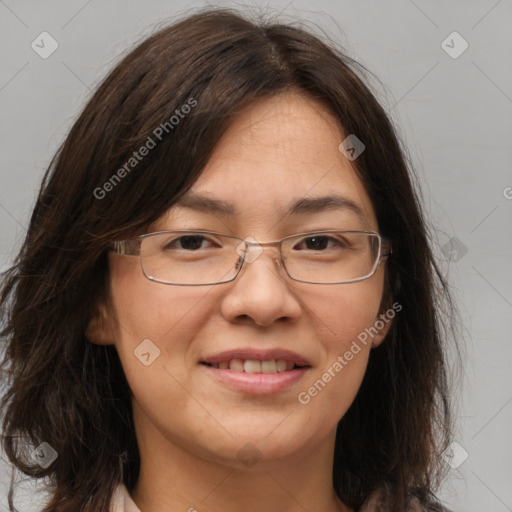 Joyful white adult female with long  brown hair and brown eyes