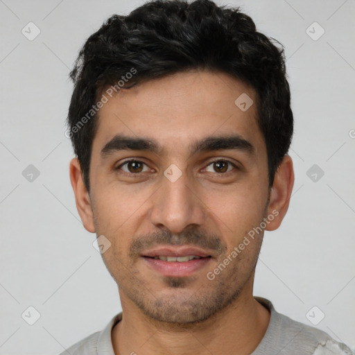 Joyful white young-adult male with short  black hair and brown eyes