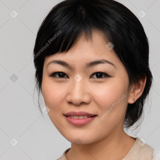 Joyful asian young-adult female with medium  black hair and brown eyes