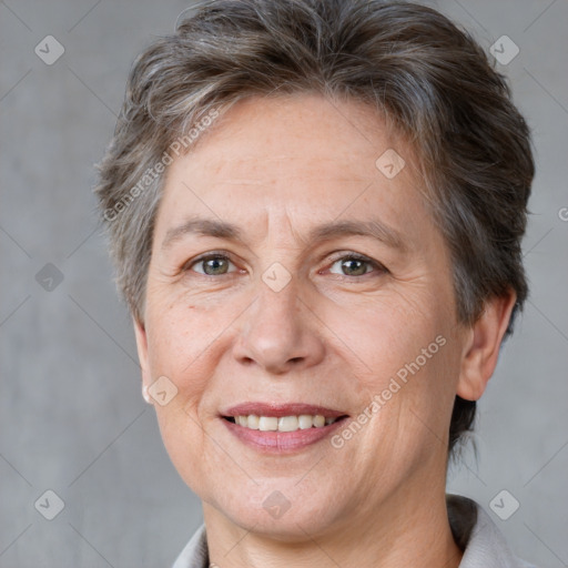 Joyful white adult female with short  brown hair and brown eyes