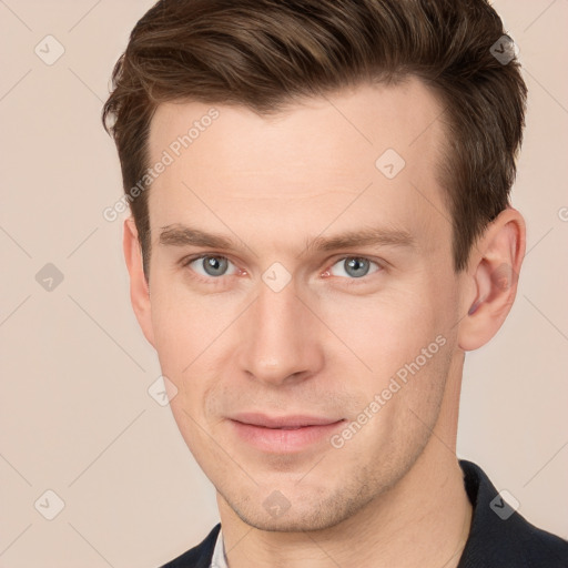 Joyful white young-adult male with short  brown hair and grey eyes