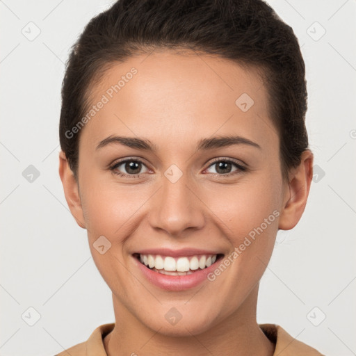 Joyful white young-adult female with short  brown hair and brown eyes