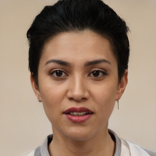 Joyful latino young-adult female with short  black hair and brown eyes