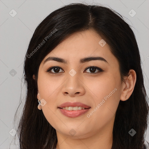 Joyful asian young-adult female with long  brown hair and brown eyes