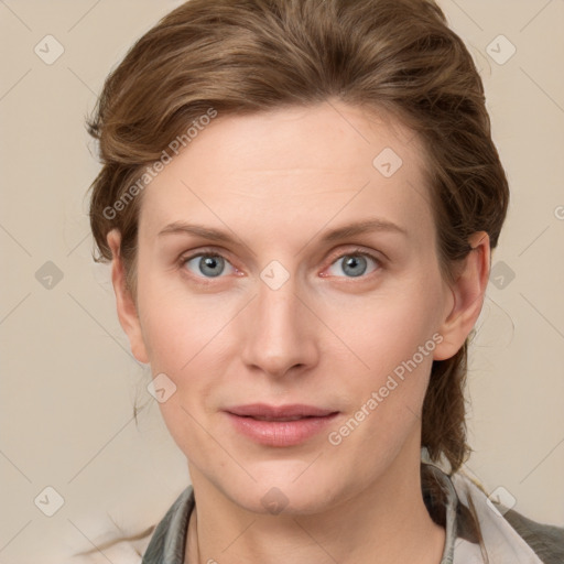 Joyful white young-adult female with medium  brown hair and blue eyes