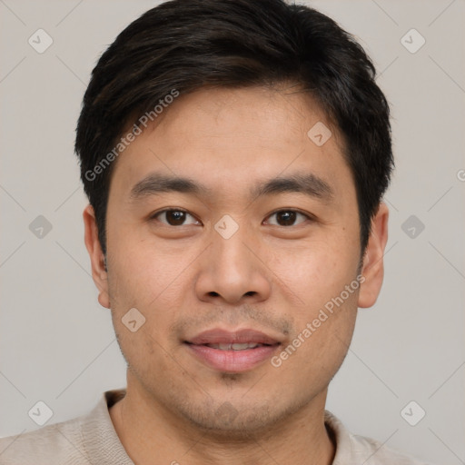 Joyful asian young-adult male with short  black hair and brown eyes