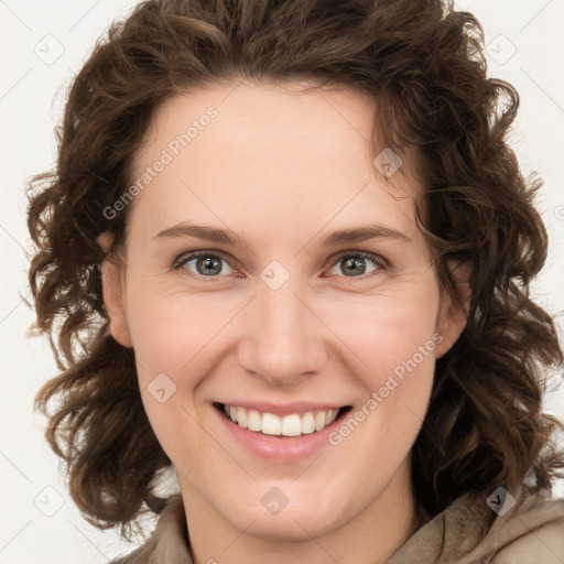 Joyful white young-adult female with medium  brown hair and green eyes