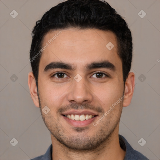 Joyful white young-adult male with short  black hair and brown eyes