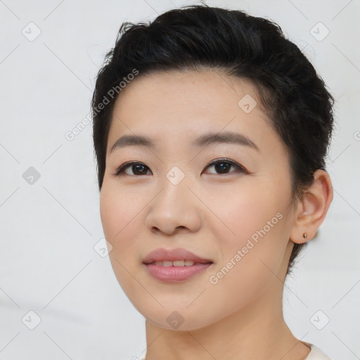 Joyful asian young-adult female with short  brown hair and brown eyes