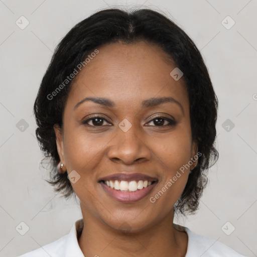 Joyful black young-adult female with medium  brown hair and brown eyes