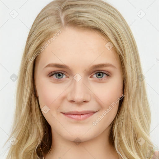 Joyful white young-adult female with long  brown hair and blue eyes