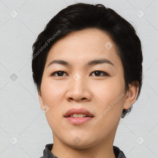 Joyful asian young-adult female with short  black hair and brown eyes