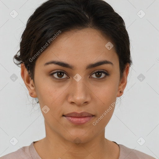 Joyful latino young-adult female with short  brown hair and brown eyes