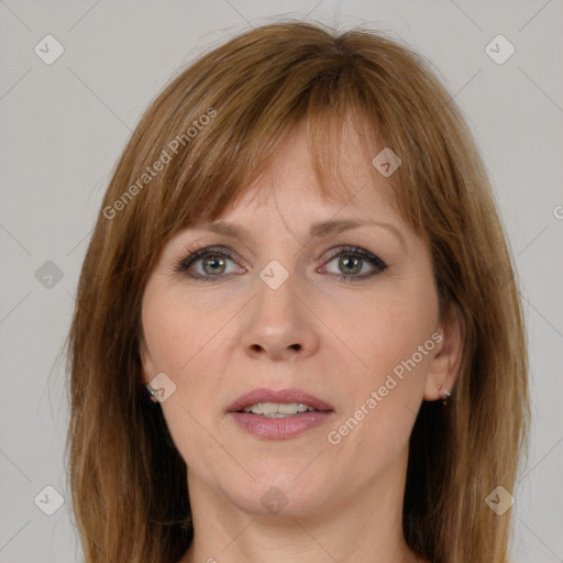 Joyful white adult female with medium  brown hair and grey eyes