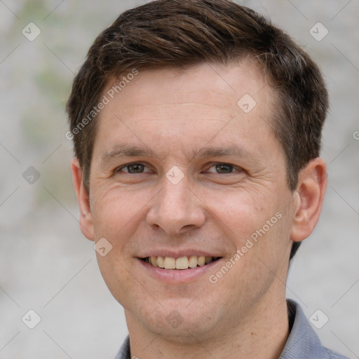 Joyful white adult male with short  brown hair and grey eyes