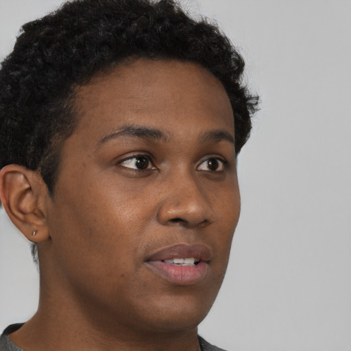 Neutral black young-adult female with short  black hair and brown eyes