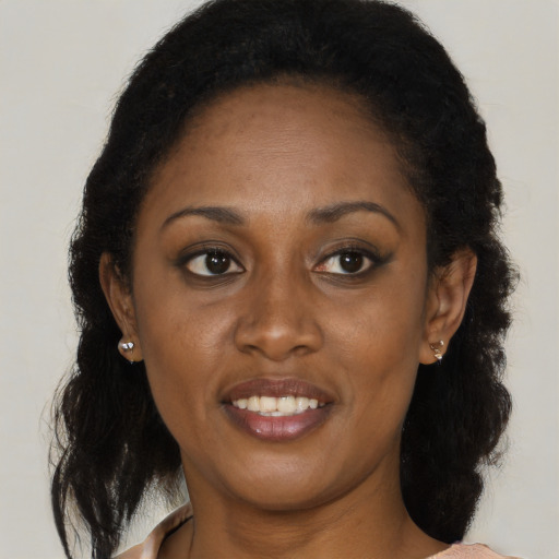 Joyful black young-adult female with medium  brown hair and brown eyes