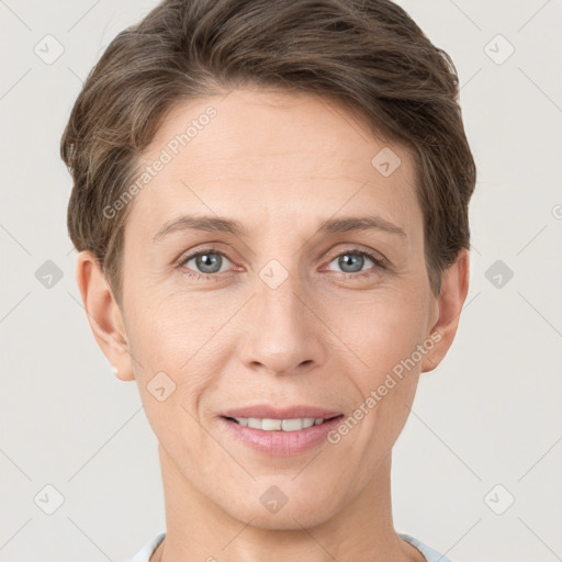 Joyful white adult female with short  brown hair and grey eyes