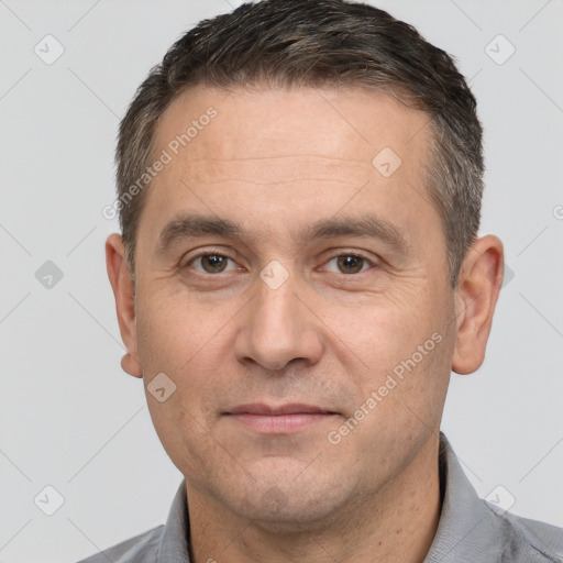 Joyful white adult male with short  brown hair and brown eyes