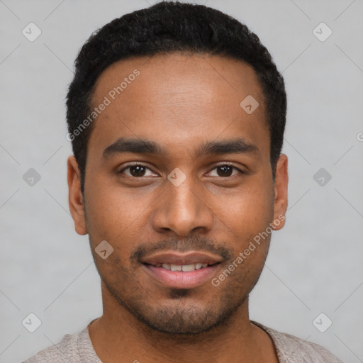 Joyful black young-adult male with short  black hair and brown eyes