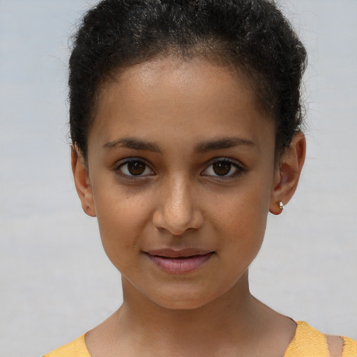 Joyful white child female with short  brown hair and brown eyes