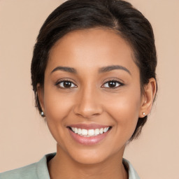 Joyful white young-adult female with long  brown hair and brown eyes