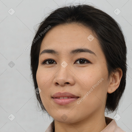 Joyful asian young-adult female with medium  brown hair and brown eyes