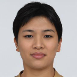 Joyful asian young-adult female with short  brown hair and brown eyes