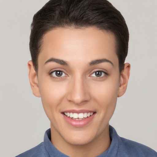 Joyful white young-adult female with short  brown hair and brown eyes