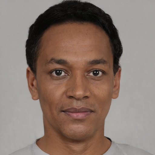 Neutral black adult male with short  black hair and brown eyes