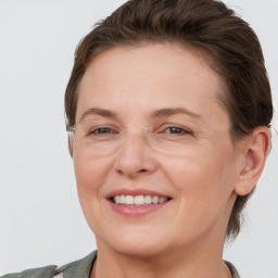 Joyful white adult female with short  brown hair and grey eyes