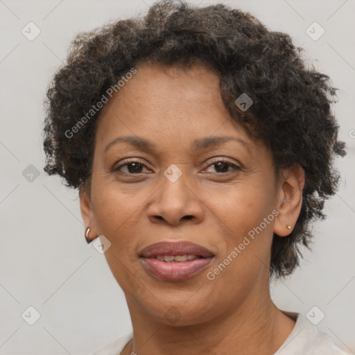 Joyful black adult female with short  brown hair and brown eyes