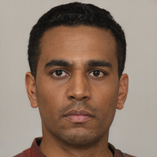 Neutral latino young-adult male with short  black hair and brown eyes